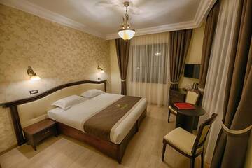 Фото номера Представительский двухместный номер с 1 кроватью Отель Magus Hotel г. Бая-Маре 8
