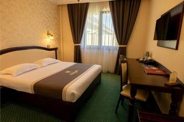 Фото номера Двухместный номер Делюкс с 1 кроватью Отель Magus Hotel г. Бая-Маре 12