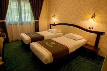 Фото номера Двухместный номер Делюкс с 2 отдельными кроватями Отель Magus Hotel г. Бая-Маре 7